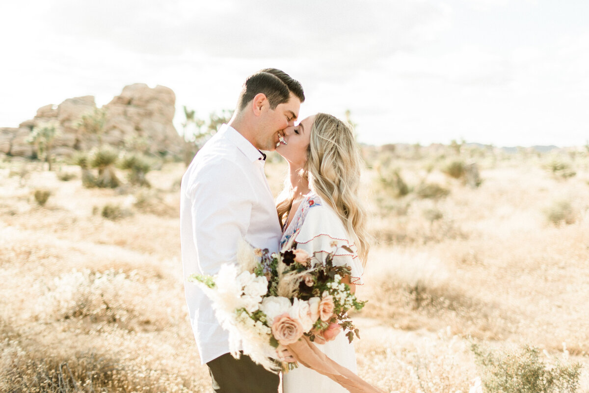 Couple in a golden field at last light