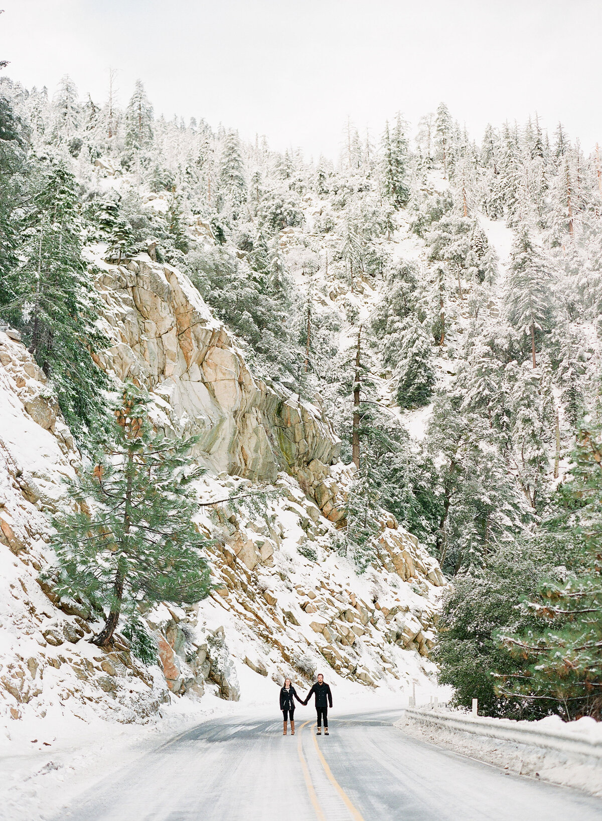 James and Cynthia in a snowy evergreen forest