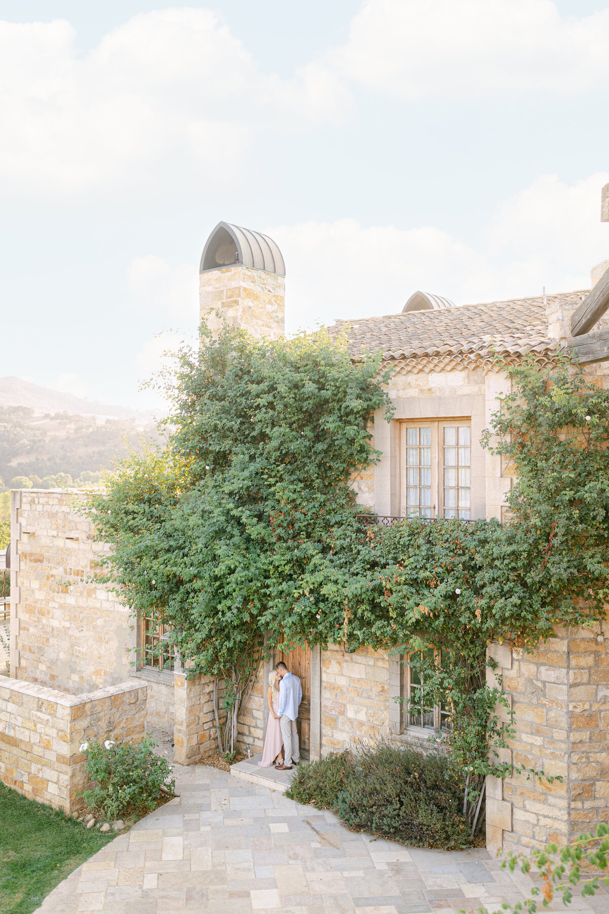 Vine-covered stone estate at golden hour