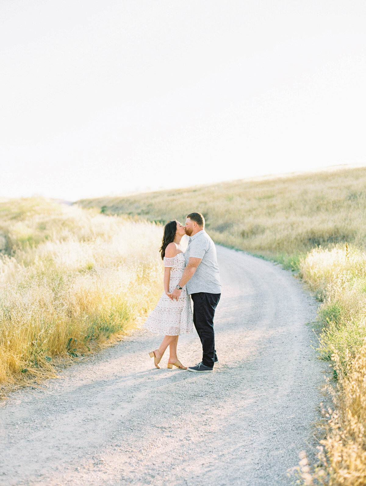 Couple beneath a brick garden archway