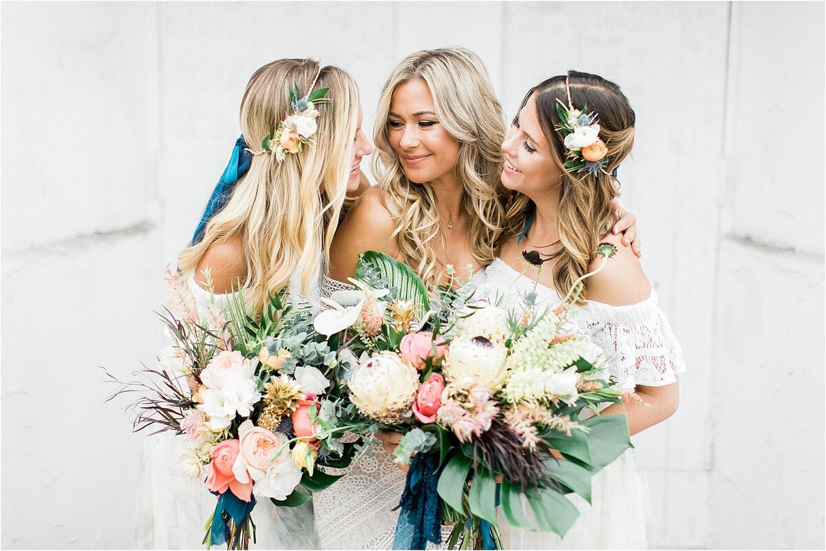 Bridesmaids with loose tropical bouquets