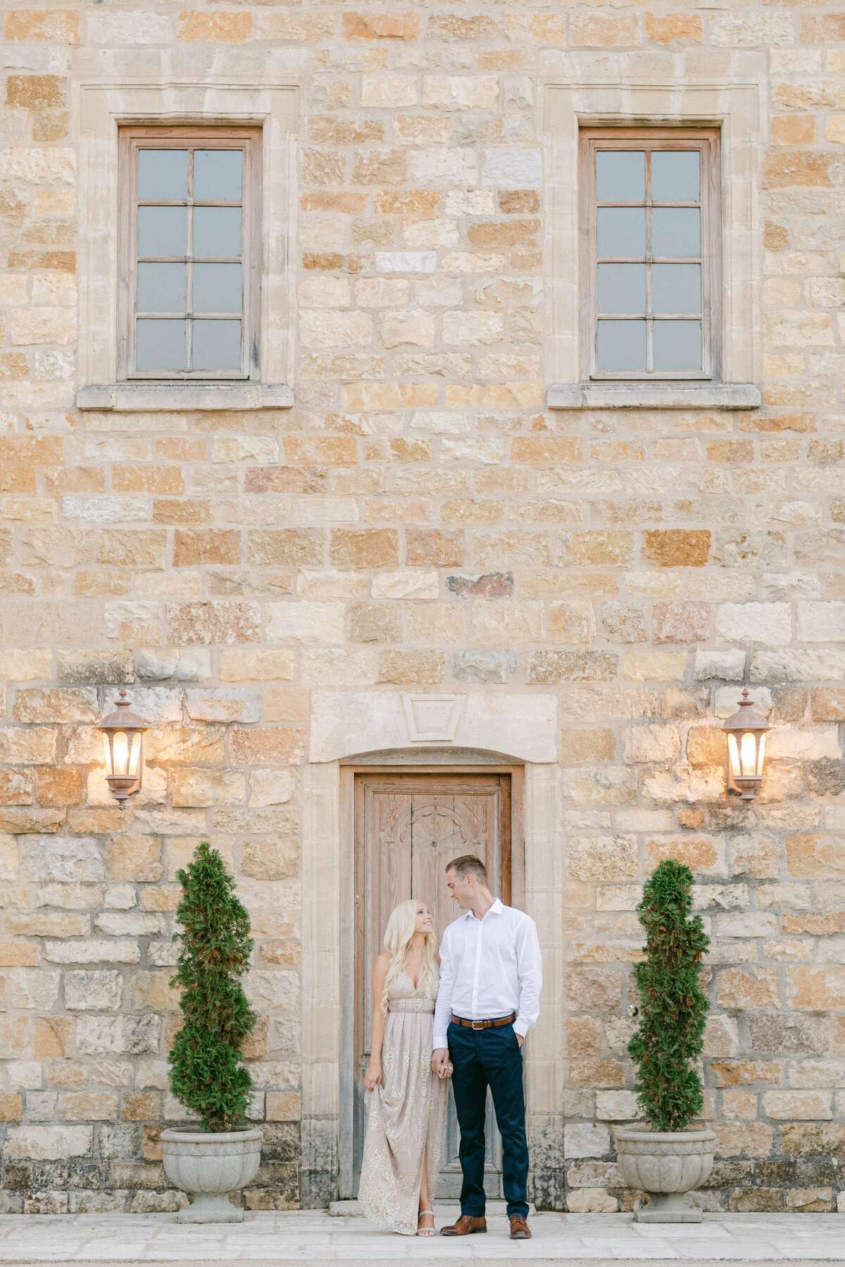 Groom waiting at the stone chapel door
