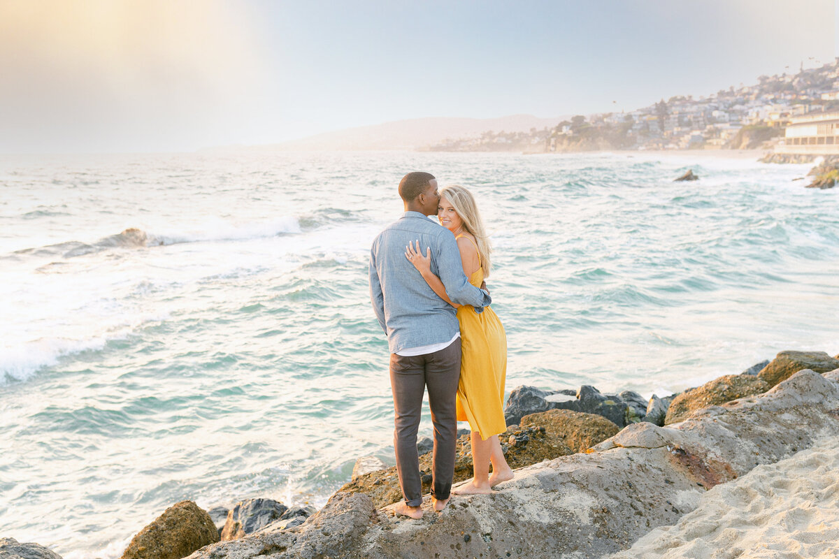 Couple on the rocks above a cove