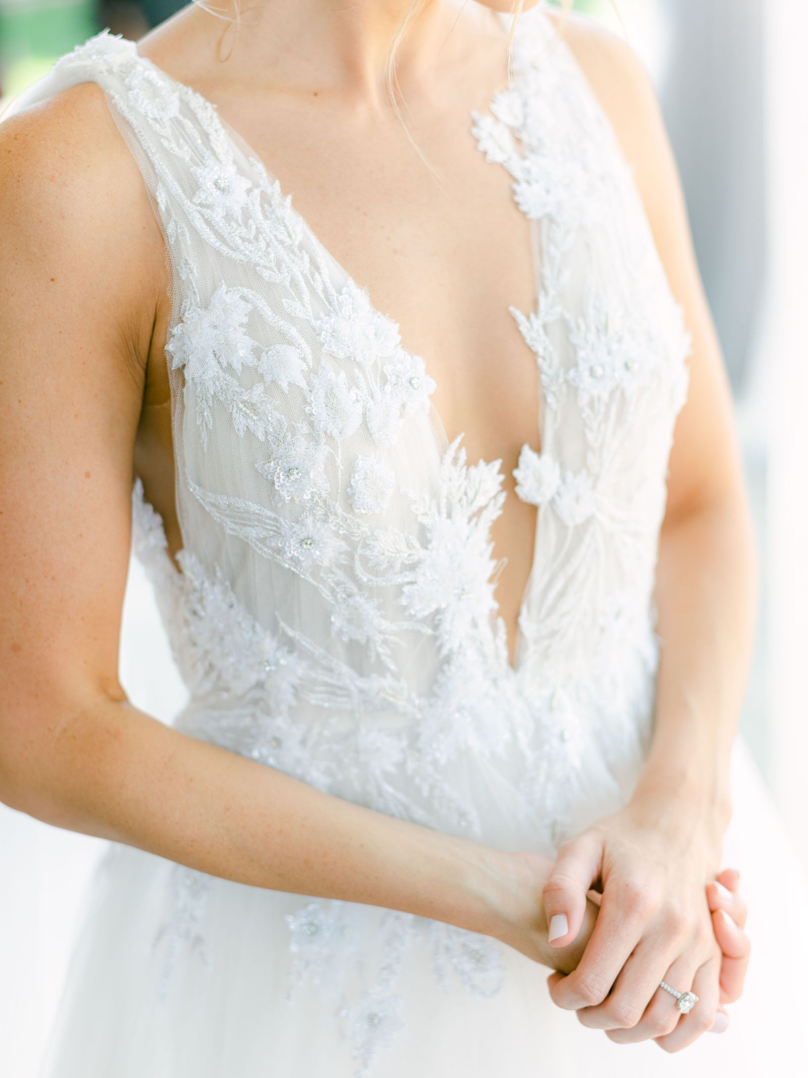 The bride in the courtyard, veil catching light