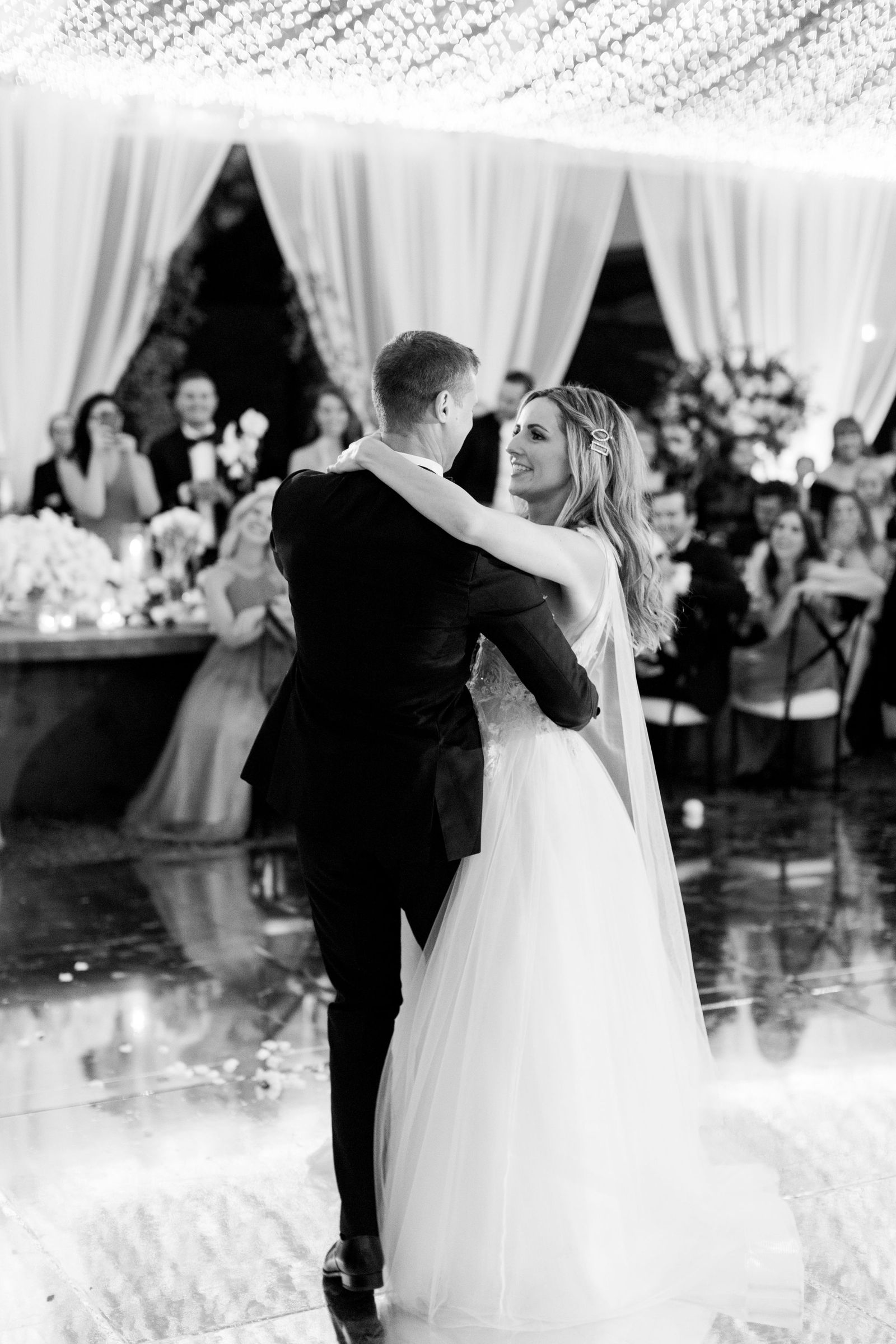 The first dance beneath the string-light canopy