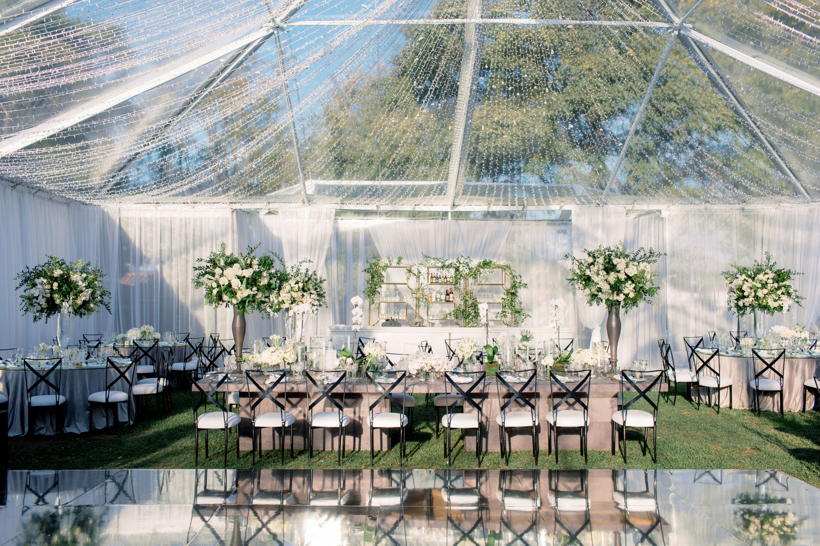 The clear-top tent set for dinner