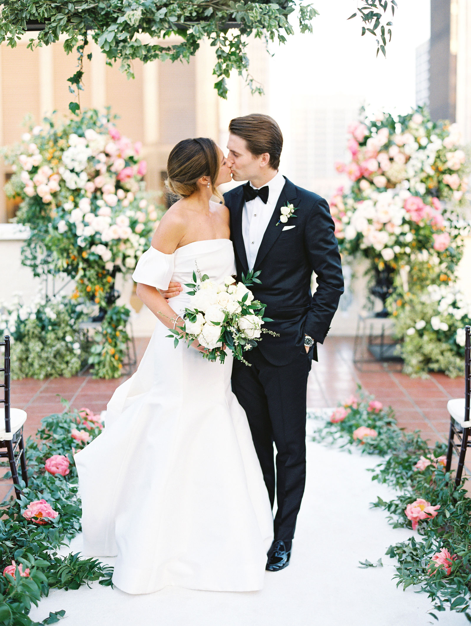 A kiss on the rooftop aisle at the Jonathan Club, downtown Los Angeles beyond