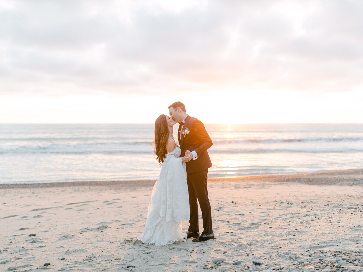 First kiss on the beach at sunset